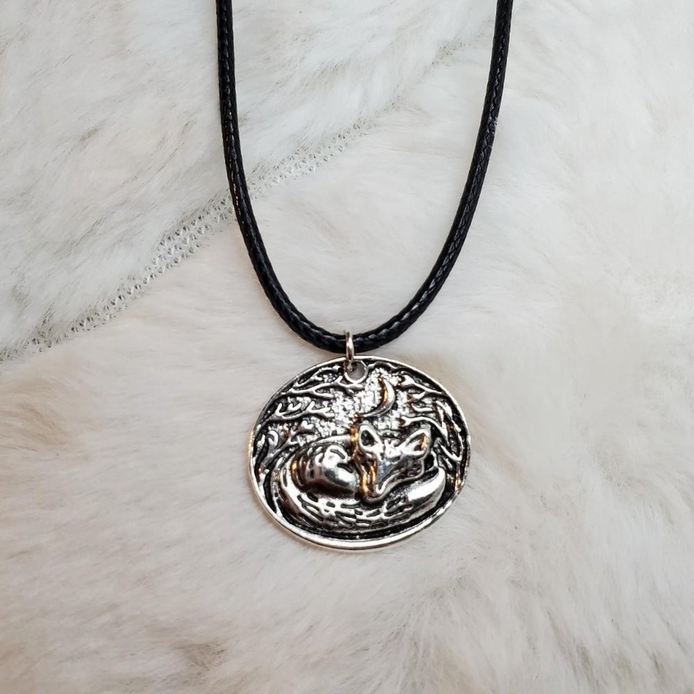 Sleeping fox charm necklace.